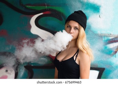 Young sexy blonde smoking