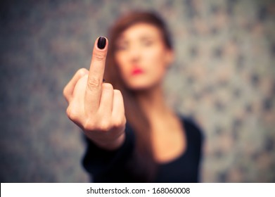 Young sexy girl showing middle finger gesture.