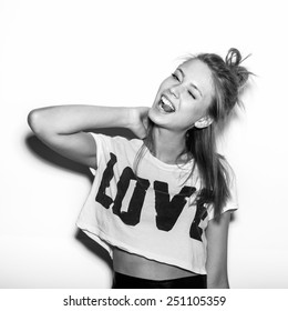 Young Sexy Happy Woman Looking At Camera.  Portrait Of Trendy Girl Having Fun. Toned Black And White. White Background, Not Isolated