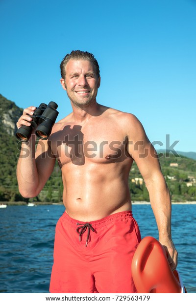 Young Sexy Muscular Man Doing Lifeguard Stock Photo (Edit Now) 729563479