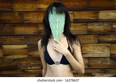 Young sexy woman with cabbage leaf mask