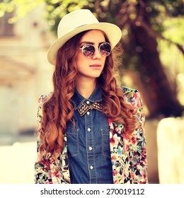 Young Sexy Woman Closeup Portrait. Stylish Hipster Girl Posing On The Street With Interested Look And Hat On Her Head. Vintage Lifestyle Trendy Portrait. Photo Toned Style Instagram Filters.