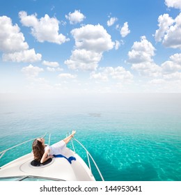 Young Sexy Woman Lies In White Dress Enjoying Clouds In The Sky On Yacht At The Sea