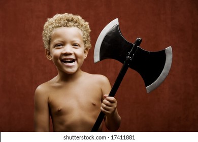 Young Shirtless Boy With A Toy Hatchet