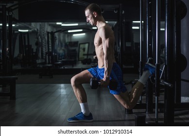 Young Shirtless Man Doing Split Squats With Weights 