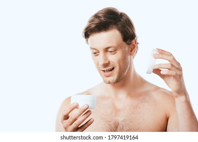 Young Shirtless Man Opening Jar Of Cosmetic Cream Isolated On White