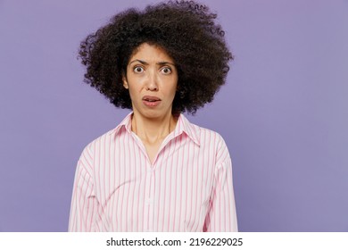 Young Shocked Scared Frightened Disappointed Dissatisfied Woman Of African American Ethnicity 20s Wear Pink Striped Shirt Look Camera Isolated On Plain Pastel Light Purple Background Studio Portrait