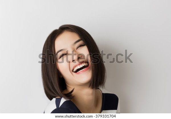 young short hair asian woman laughing  stockfoto jetzt