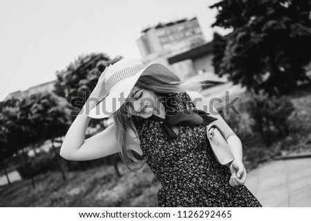 Similar – Image, Stock Photo Smiling girl with a hat pulling from her boyfriend hand in the street to take a walk.