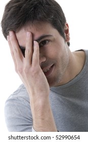 Young Shy Man With Hand Over His Face