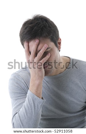 Young shy man with hand over his face