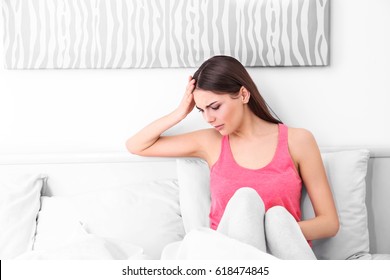 Young Sick Woman In Bed At Home