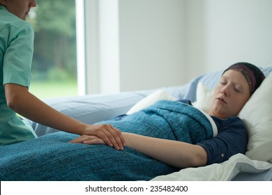 Young Sick Woman Sleeping In Her Bed