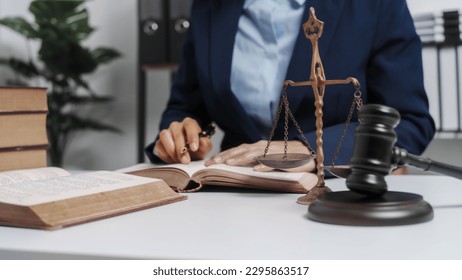 Young single female lawyer asian people in formal suit real estate working law book and contract documents, Arguments for Defense Strategy. Fight for Freedom. Supporting Evidence. - Shutterstock ID 2295863517