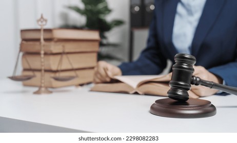 Young single female lawyer asian people in formal suit real estate working law book and contract documents, Arguments for Defense Strategy. Fight for Freedom. Supporting Evidence. - Shutterstock ID 2298082283