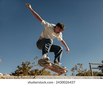 Young skateboarder flies with his board on the ramp of a skate park - Powered by Shutterstock