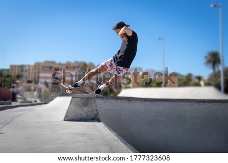 Similar – teenager practicing with skateboard at sunrise city