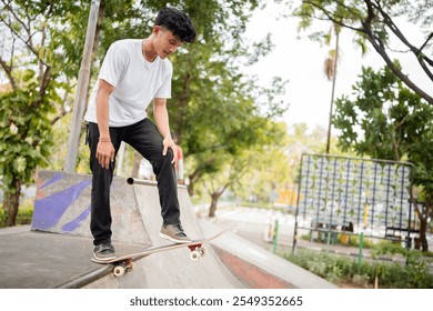 A young skateboarder performs tricks at a vibrant skatepark surrounded by greenery - Powered by Shutterstock