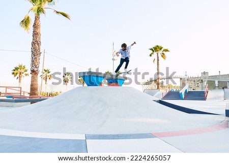 Similar – Image, Stock Photo Young bearded skater performing trick in skatepark