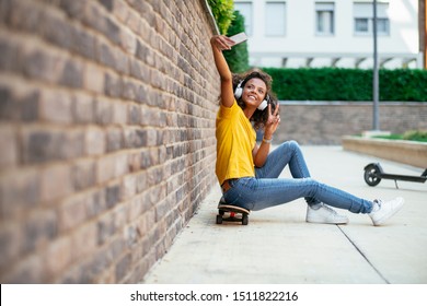 Young Skater Girl Taking Selfie