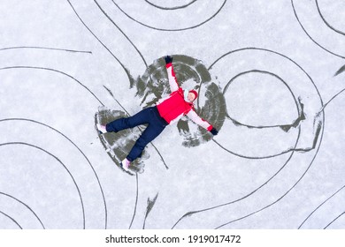 Young Skater Having Fun On Ice. Skate Rink From Above.  Winter Sport Theme.