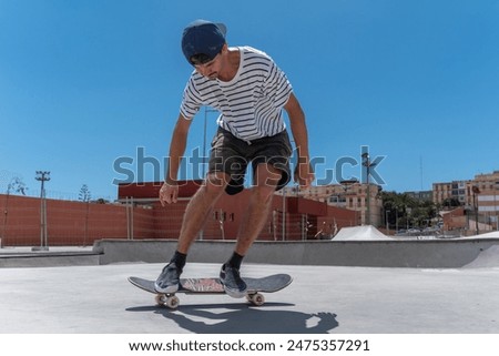 Similar – teenager practicing with skateboard at sunrise city