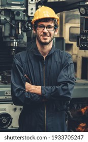 Young Skillful Factory Worker Or Engineer Close Up Portrait In Factory . Industry And Engineering Concept .