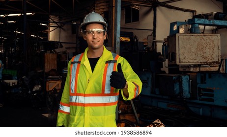 Young Skillful Factory Worker Or Engineer Close Up Portrait In Factory . Industry And Engineering Concept .