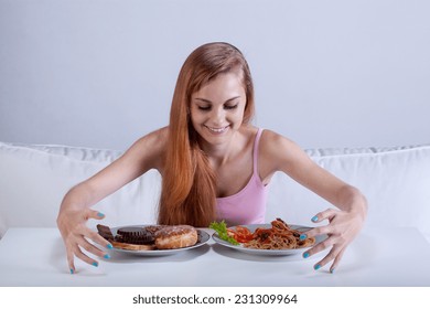 Young skinny girl binging on lots of food