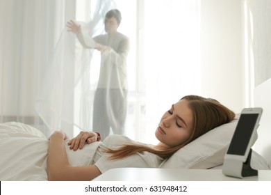 Young Sleeping Woman In Bed With Sleepwalker On Background