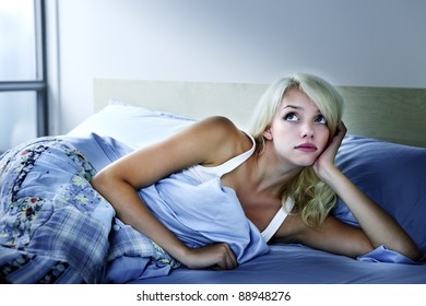 Young Sleepless Woman Laying In Bed With Insomnia