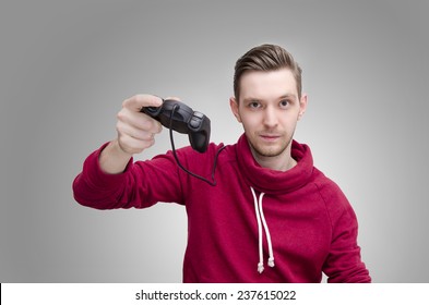 Young Slicked Back Hair Man Holding Game Controller On Gray Gradient Background 