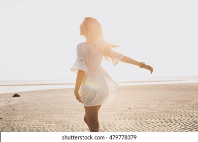 Young Slim Beautiful Woman On Sunset Beach, Playful, Dancing, Bohemian Outfit, Indie Style