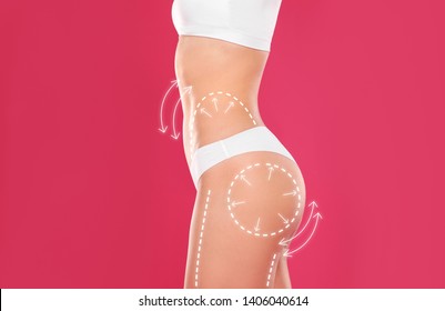Young slim woman with arrows on body against color background, closeup. Beauty and health concept