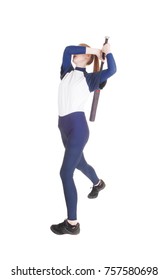 A young slim woman playing softball, swinging her bad to hit the ballin a blue uniform, isolated for white background