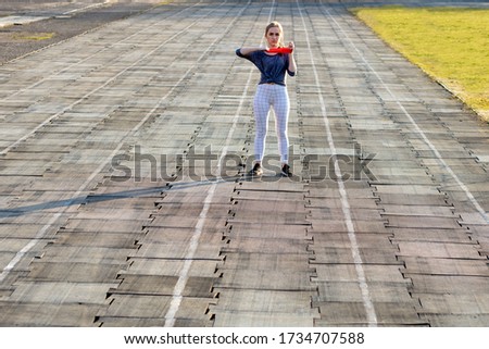 Similar – Senior sportswoman with headphones running