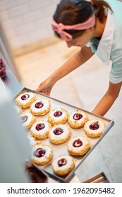 A Young Small Business Female Owner Is Preparing Her Handmade Delicious Donuts Of Irresistible Appearance For A Pastry Shop. Pastry, Dessert, Sweet, Making