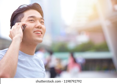 Young Smart Asian Male Teen Calling Phone Call Communication With Other