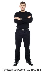 Young smart bouncer posing with his arms crossed isolated over white background.