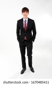 Young Smart Handsome Asian Man Business Office Wearing Suit Tie On White Background Walk Forward 