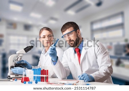 Young smart scientist or research work in medical laboratory