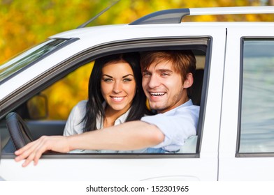 Young Smile Couple Driving Car, Fall Season, Golden Autumn Trees, Yellow Leaves Background