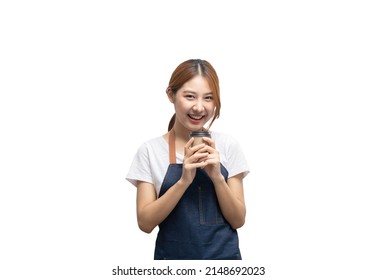 Young Smiling Asian Female Barista Bartender Coffee Maker Woman In Apron Holding Paper Coffee Cup, Selling Hot Beverage Tea Isolated In White Background. Clipping Path.