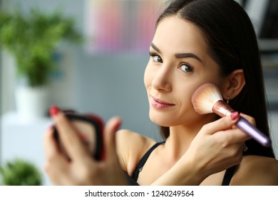 Young Smiling Beautiful Brunette Woman Make Her Face Up With Brush And Powder Putting Rouge In Mua Office Portrait