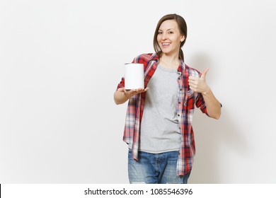 Young smiling beautiful woman holding empty paint tin can with copy space and showing thumb up isolated on white background. Instruments, tools for renovation apartment room. Repair home concept