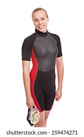 
Young Smiling Blonde Woman In A Wet Suit For Swimming Poses Holding A Mask. Studio Short. Isolated On White Background.