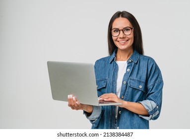Young smiling caucasian student freelancer woman using laptop for remote work, e-learning at university college, e-banking, online shopping, webinars isolated in white background - Shutterstock ID 2138384487