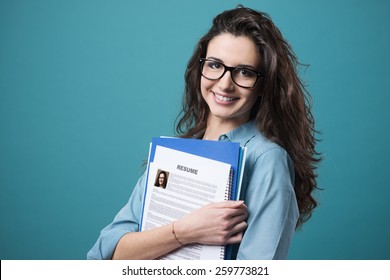 Young Smiling Cheerful Woman Holding Her Resume