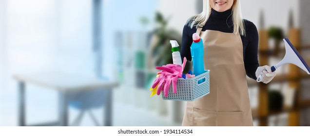 Young Smiling Cleaner Woman In Modern House