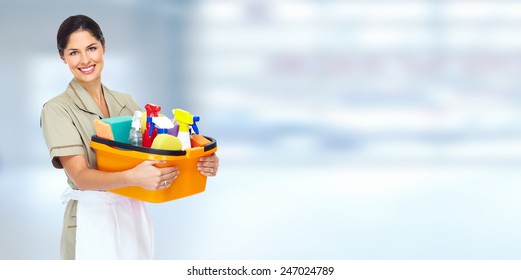 Young Smiling Cleaner Woman In Modern House.